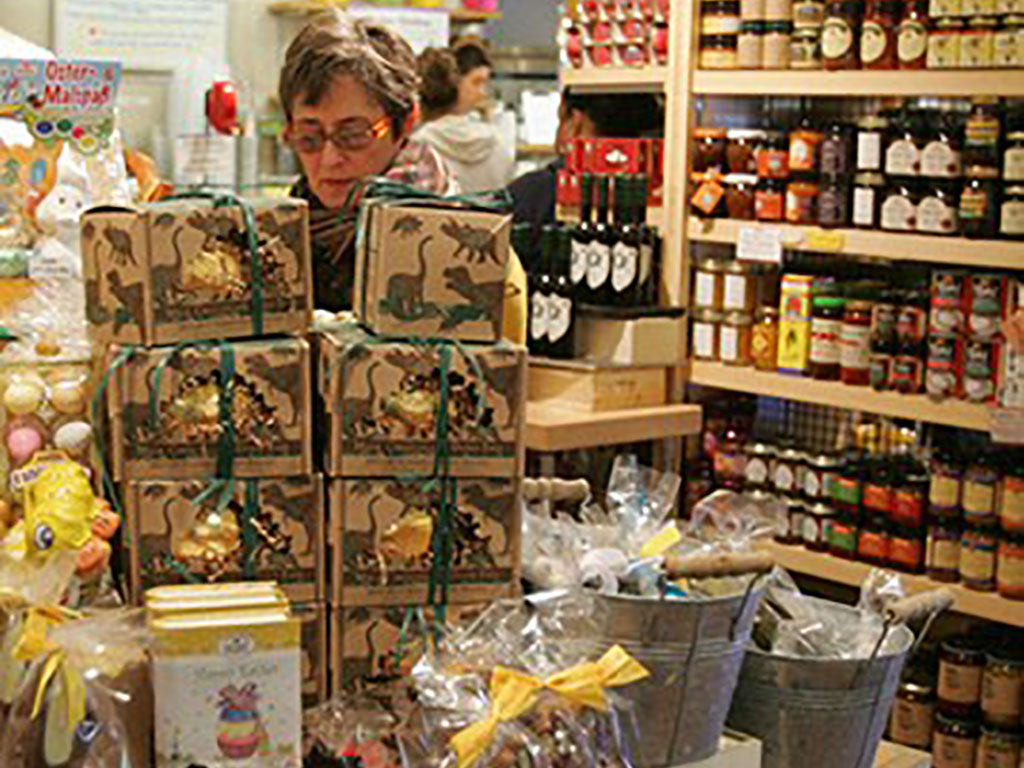 Interior view of a person shopping in one of the isles of The Pasta Shop at Rockridge Market Hall, an Oregon Growers retailer.