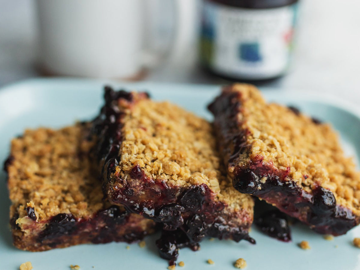 Close-up of Blueberry Crumble Bars on a serving plate that were prepared with a recipe using Oregon Growers' Blueberry Jam.
