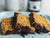 Close-up of Blueberry Crumble Bars on a serving plate that were prepared with a recipe using Oregon Growers' Blueberry Jam.