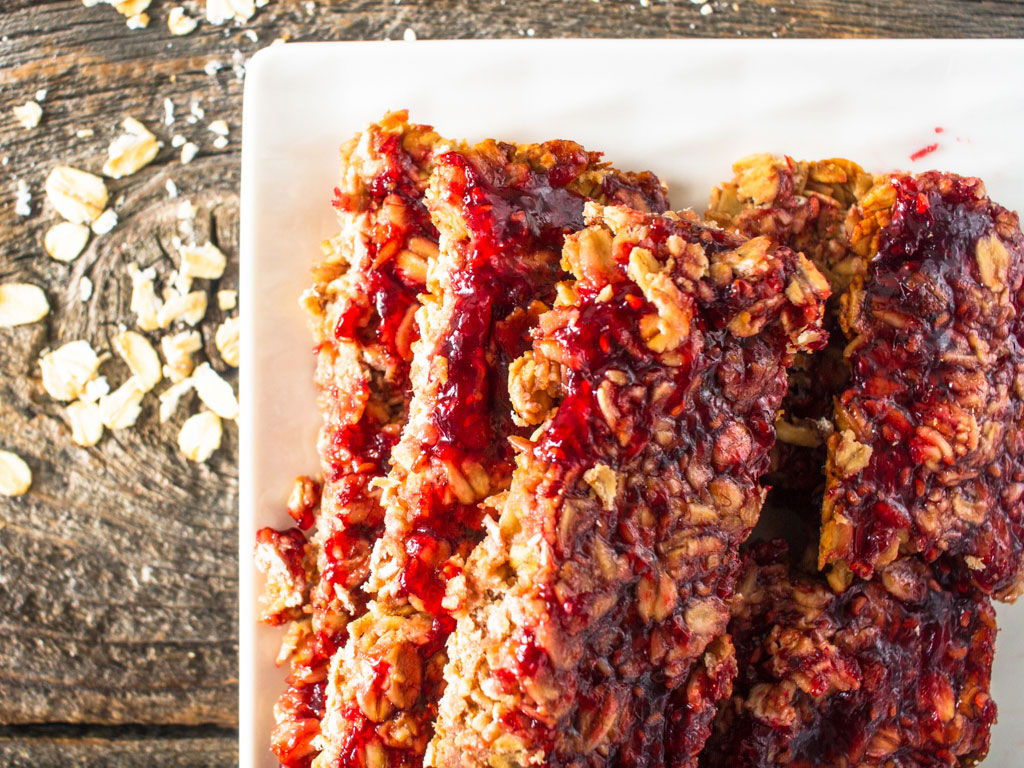 Close-up view of chewy granola bars prepared with a recipe including Oregon Growers Jam, peanut butter, and oats.