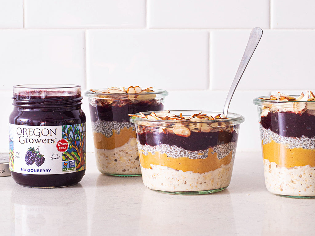 Tabletop display of Overnight Oats with Chia Seed Pudding and Oregon Growers Marionberry Jam in bowls next to jar of preserves