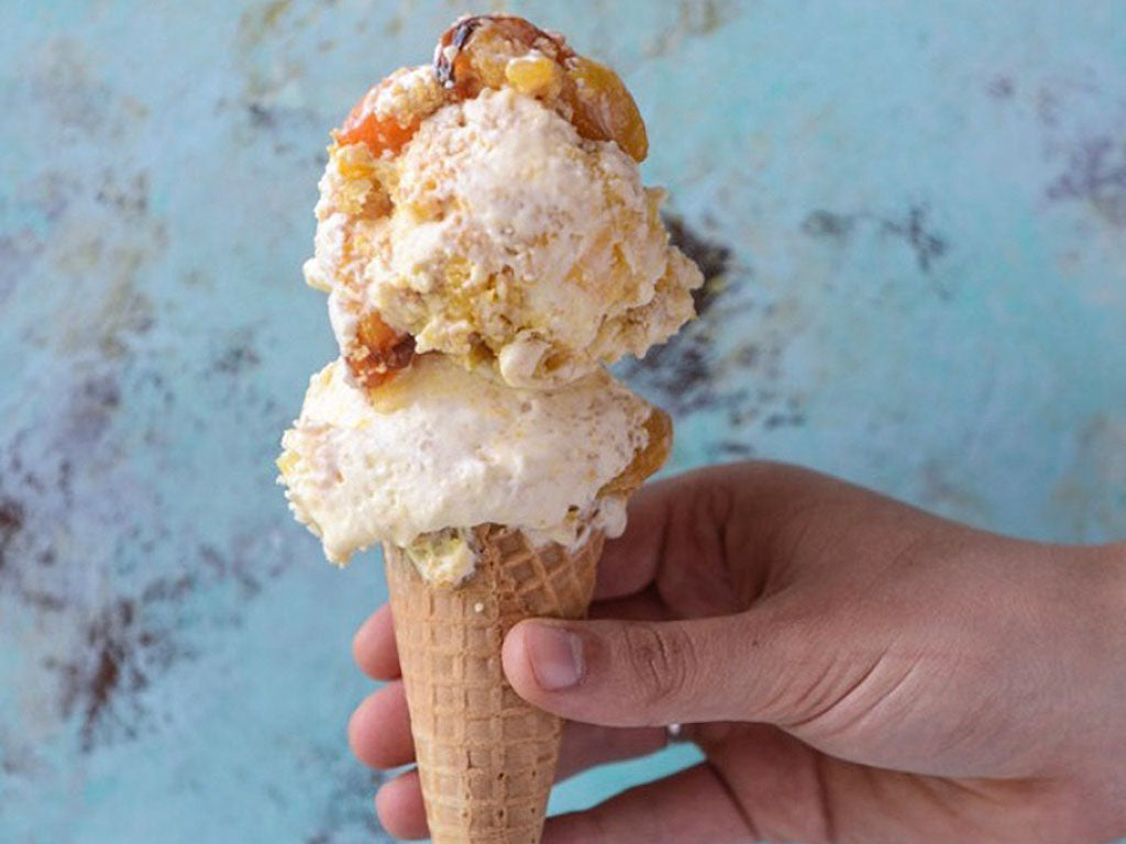 Close-up of an ice cream cone prepared with Oregon Growers Peach jam in the recipe with sugar, vanilla, and cream.