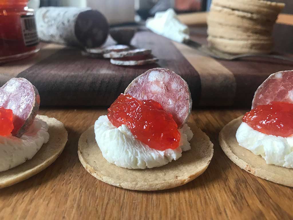 Gluten-free Crackers topped with Smoked Pepper Pate (Oregon Growers), salami, and cheese.