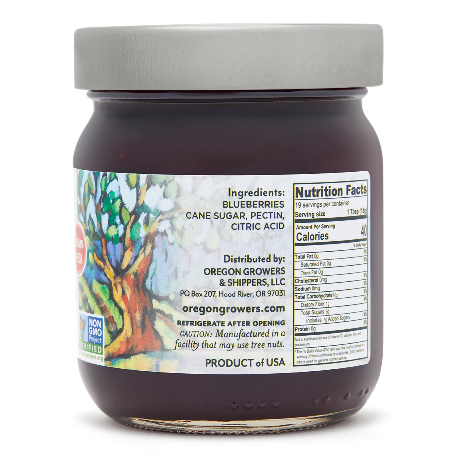 Close-up right side view of Oregon Growers Blueberry Jam in a 12 oz. jar, highlighting a label with ingredients, nutritional facts, and product details.