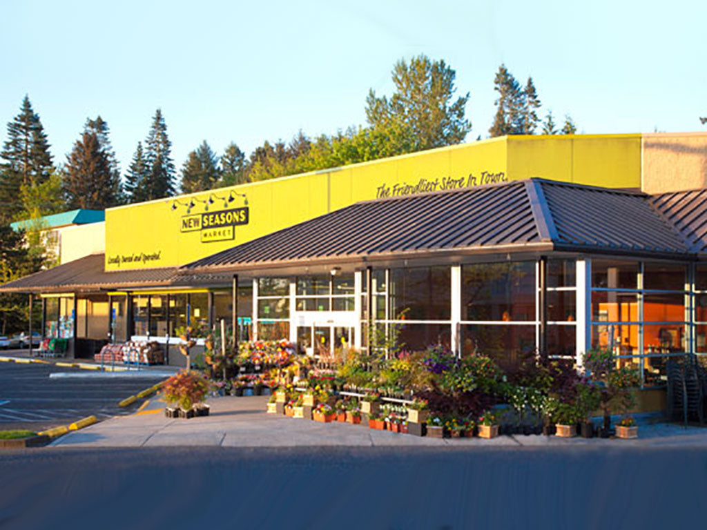 The exterior view of the New Seasons Market, with thirteen locally owned stores supporting local farms and sustainable agriculture.