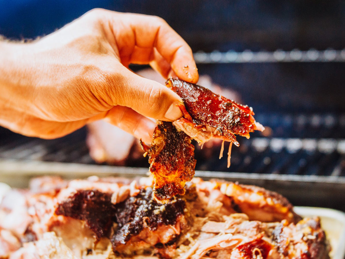 Pulled pork heaped on a serving plate, covered in juicy barbecue sauce using one of the Oregon Growers jams.