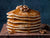 Stack of pancakes prepared with Oregon Growers Pumpkin Butter as an ingredient in the batter and drizzled with Maple Syrup. 