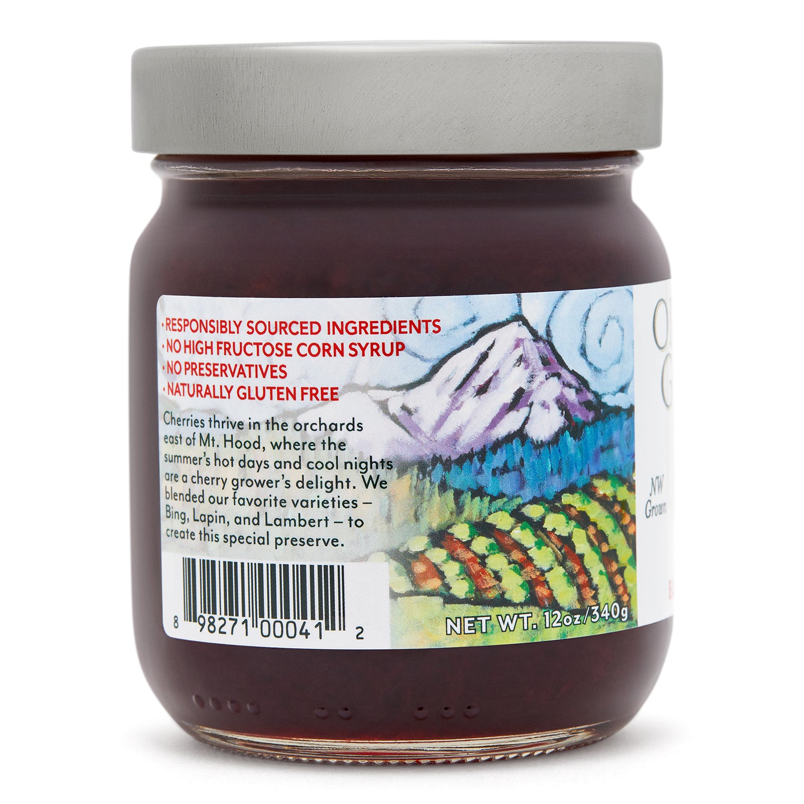 Close-up left side view of the Oregon Growers Black Cherry Jam 12 oz. glass jar.