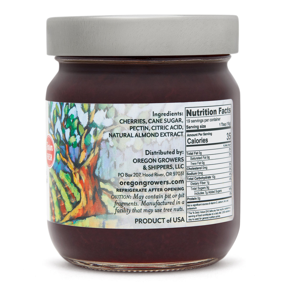 Close-up right side view of the Oregon Growers Black Cherry Jam 12 oz. glass jar, highlighting a label with ingredients, nutritional facts, and product details. 