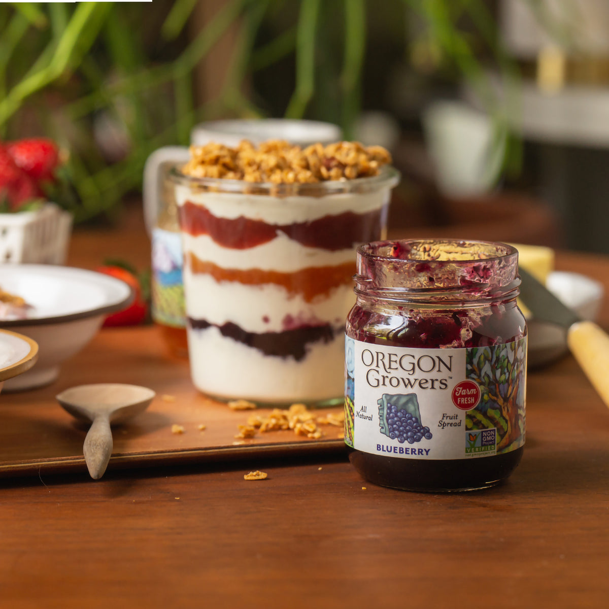 Yogurt Parfait prepared with our Oregon Growers Blueberry Jam, on a table next to each other.