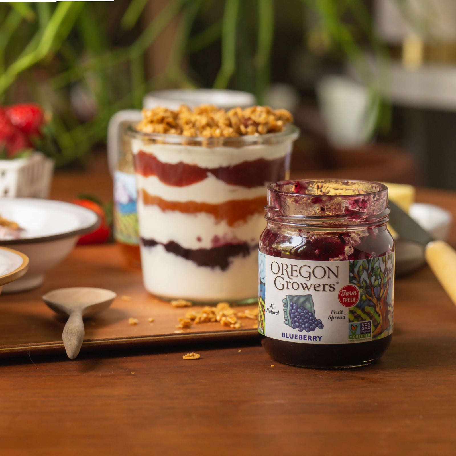 Yogurt Parfait prepared with our Oregon Growers Blueberry Jam, on a table next to each other.