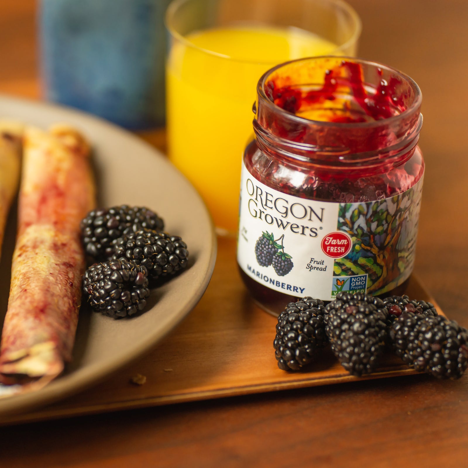 Breakfast Crepes on a plate in the morning, next to our 12 oz Oregon Growers Marionberry Jam jar.