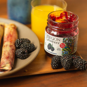 Breakfast Crepes on a plate in the morning, next to our 12 oz Marionberry Jam jar.