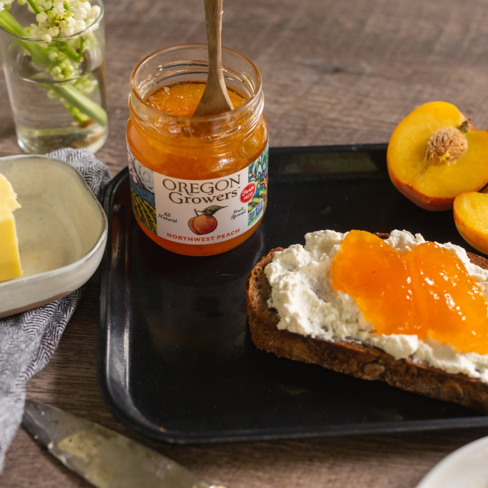Breakfast tray on a table with our Oregon Growers Northwest Peach Jam and covered toast.