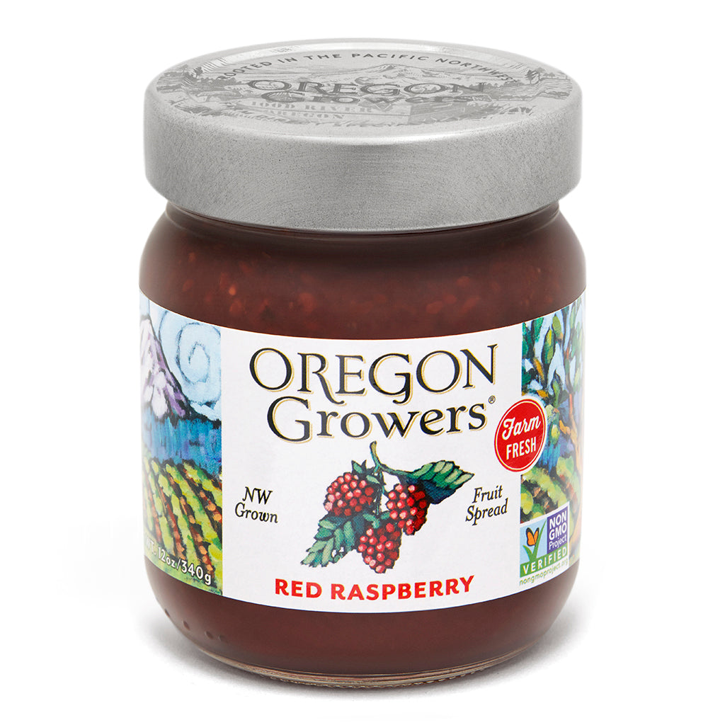 Close-up view (front side) of our Red Raspberry Jam in the 12 ounce jar with the colorful label and 'FARM FRESH' badge.