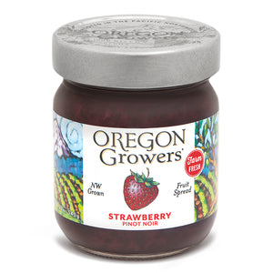 Close-up view (front side) of our Strawberry Pinot Noir Jam in the 12 ounce jar with the colorful label and 'FARM FRESH' badge.