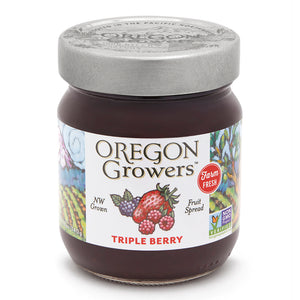 Close-up view (front side) of our Triple Berry Jam in the 12 ounce jar with the colorful label and 'FARM FRESH' badge.